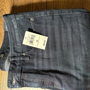 Medium to dark wash blue denim classic straight-leg jeans
